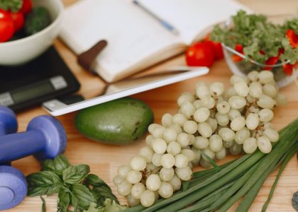 A vibrant composition of fruits, vegetables, and fitness items promoting a healthy lifestyle.